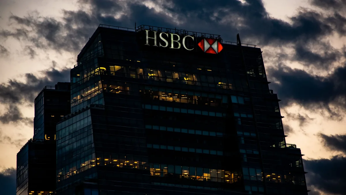The HSBC building, a large structure with the company's logo prominently displayed on top.