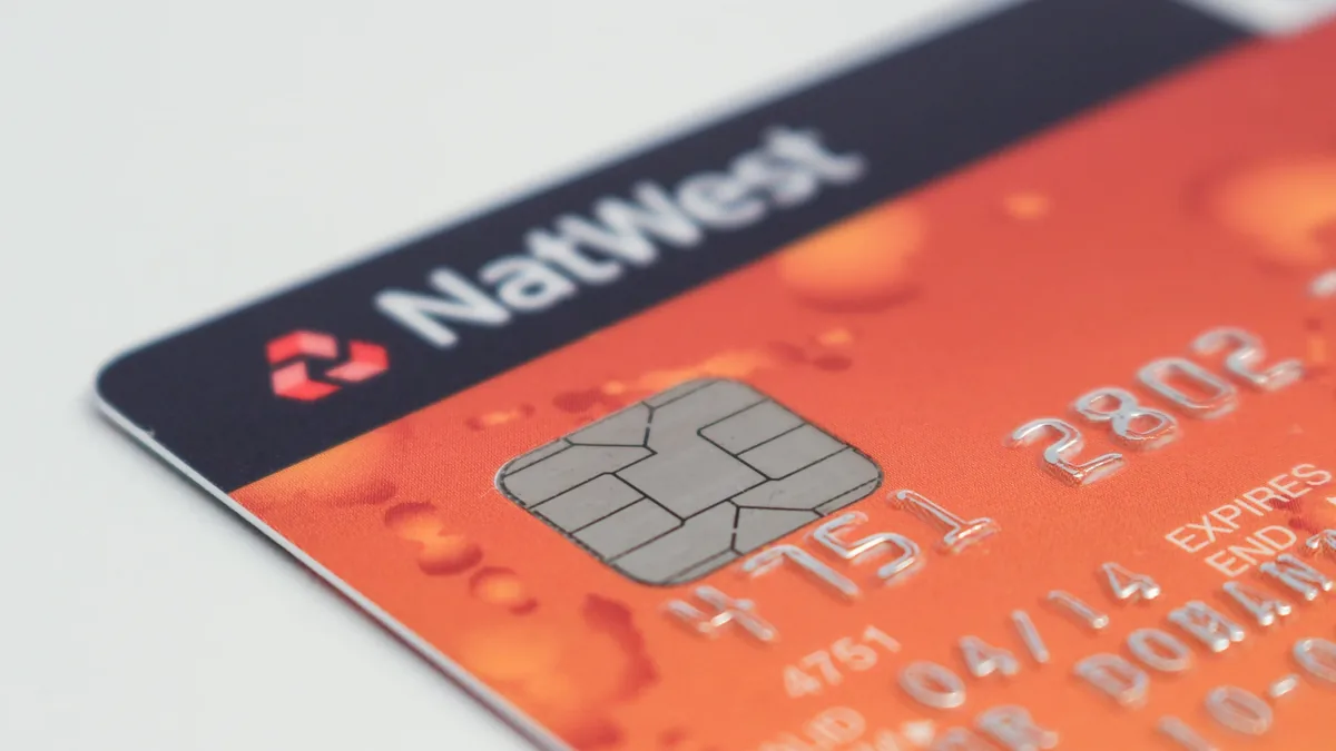 A close-up of a credit card with the NatWest logo and a chip on the front.